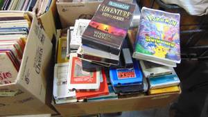 lot 21 image: Lot of Various 8 Tracks, VHS-Pokemon. Dolly Parton, Chicago, Bob Dillian, Neil Diamond, Plus More