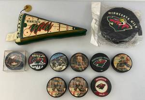 lot 189 image: Misc. Vintage Minnesota Wild Collectibles including Hockey Pucks & More