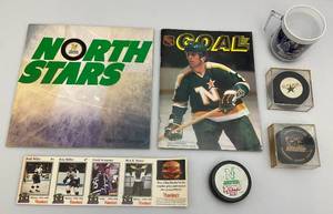 lot 190 image: Misc. Vintage Minnesota North Stars Collectibles including Hockey Pucks & More