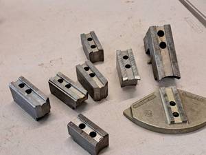 lot 83 image: Lot of (8) Assorted Ram Chuck Jaws  Various Sizes and Dimensions