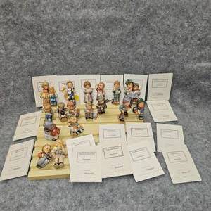lot 65 image: Complete Hummel 19 Piece Christmas Porcelain Children Set