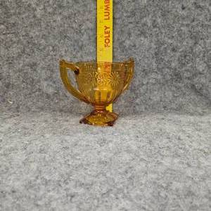 lot 91 image: Indiana Glass Ampber Depression Saisy Sugar Bowl, Open Top, Square Footed