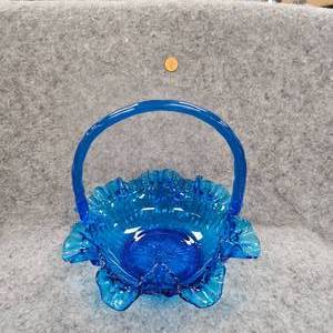 lot 101 image: Fenton Royal Blue Thumbprint Ruffle Glass Basket wrepair at Handle Basees