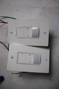 lot 210 image: Pair of Used Wall-Mounted Light Dimmer Switches
