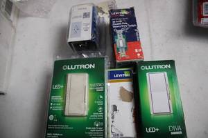 lot 380 image: Collection of Lutron LED Dimmer Switches & Leviton Wall Plugs