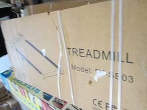 lot 33 image: treadmill doesnt look opened...