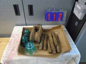 lot 112 image: Qty of 2 boxes of insulators with pulley. As shown.