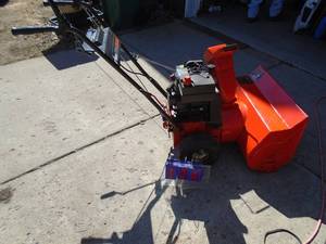 lot 134 image: Ariens 5 hp snow blower. Used condition. Tested & works. As shown.