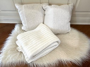 lot 25 image: Threshold White Textured Throw Blanket and Pillow Set on Faux Fur Rug