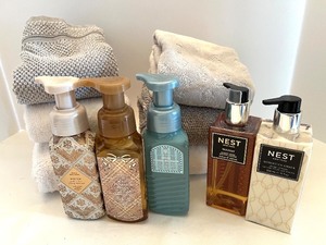 lot 52 image: Collection of Bath & Body Works Hand Soaps and NEST Hand Lotions with Towels