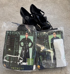 lot 212 image: Set of 2 (Man and Woman) Matrix Movie Halloween Costumes with Black Heels