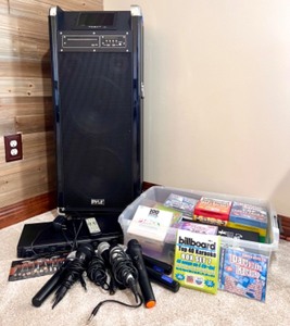 lot 123 image: Pyle Karaoke Machine Package with Wireless Microphones and Karaoke CD Collection