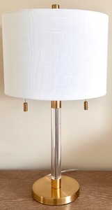lot 326 image: Safavieh Brass and Acrylic Table Lamp with White Drum Shade