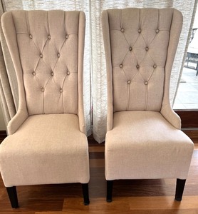 lot 8B image: Pair of Elegant Beige Wingback Dining Chairs with Button Tufting #2