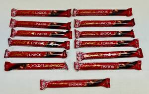 lot 94 image: SSS. 13x Lindt Lindor Milk Chocolate Truffle Bars