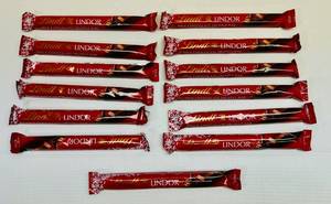 lot 96 image: SSS. 13x Lindt Lindor Milk Chocolate Truffle Bars