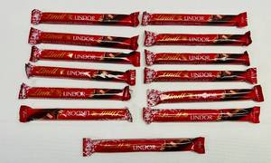 lot 98 image: SSS. 13x Lindt Lindor Milk Chocolate Truffle Bars
