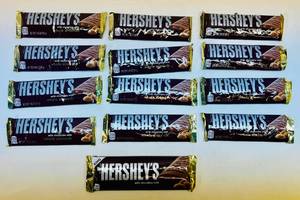 lot 100 image: SSS. 13x 1.45oz Hersheys Milk Chocolate with Whole Almonds