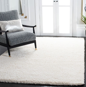 lot 86 image: Safavieh Milan Shag 10 x 14 (ft) Loomed Polypropylene Ivory Rectangular Indoor Solid Area rug