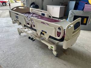 lot 329 image: Stryker Hospital Bed Bad Caster