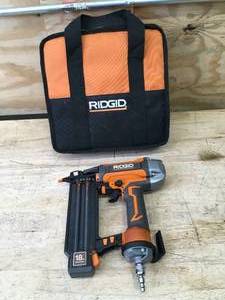lot 31 image: RIDGID Pneumatic 18-Gauge 2-18 in. Brad Nailer with CLEAN DRIVE Technology, and Tool Bag Model # R213BNF3
