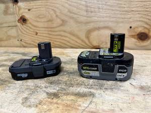 lot 142 image: RYOBI ONE 18V Lithium-Ion 1.5 Ah Battery and ONE 18V 4.0 Ah Lithium-Ion HIGH PERFORMANCE Battery