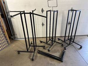 lot 16 image: 3 Rolling Clothing Display Racks