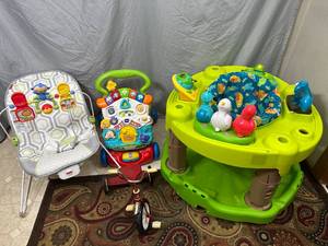 lot 53 image: Assorted Baby Items, Exersaucer, Bouncer, Walking Roller, Small Trike