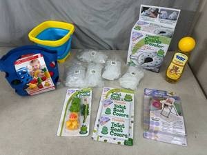 lot 83 image: New Baby Supplies, Toys, Outlet Covers, Toilet Seat, Mess Mat, and More