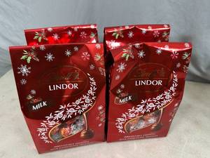 lot 259 image: 4 Bags of Lindt Lindor Milk Chocolate Truffles