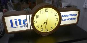 lot 64 image: Miller Lite clock and beer light