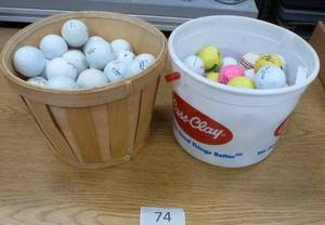 lot 74 image: Two buckets of golf balls