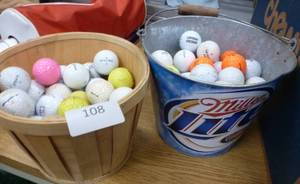 lot 108 image: 2 buckets of golf balls with a miller lite ice bucket