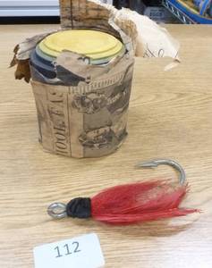 lot 112 image: stack of vintage Blue Rock clay pigeons (about 10) and vintage hand made lure