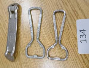 lot 134 image: HAMMS, Grain Belt and Schlitz beer openers