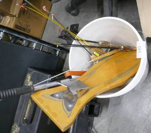 lot 145 image: Bucket of ice fishing poles, fish cleaning board, gaff, spoon