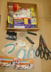 lot 156 image: Misc lot of gun locks, multi-meter, scissors, snips, wrench, bobber, etc