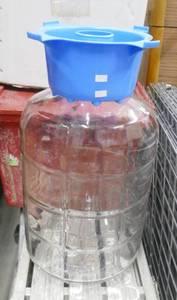 lot 234 image: Beer making supplies - 5 gallon jug, box of misc supplies, 6 cases of bottles, strainer