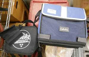 lot 245 image: Cabelas collapsible cooler, Smoky moonshine cooler, 2 person furniture mover strap