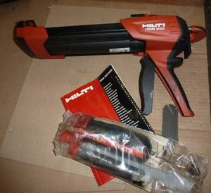 lot 267 image: Hilti epoxy gun with tubes of epoxy