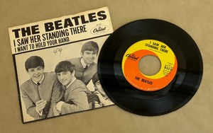 lot 383 image: The Beatles 45 Record Album I Want to Hold Your Hand and I Saw Her Stand There