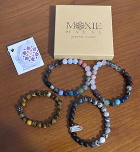 lot 285 image: Four Moxie Malas Beaded Bracelets