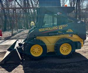 2002 New Holland LS 160 Skid Loader, 46 H.P. 4-Cylinder Diesel Engine.