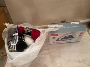 lot 7 image: Singer Perfect Finish II Iron and Bundle of Yarn with Knitting Needles