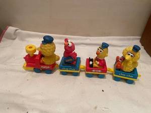 lot 56 image: Vintage Sesame Street Train Set Featuring Big Bird, Elmo, Bert, and Ernie