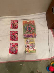 lot 58 image: Collection of 6 Polly Pocket and Dora the Explorer Dolls