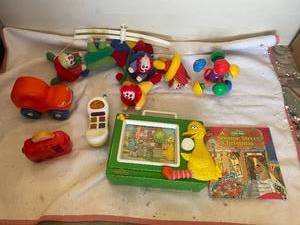 lot 101 image: Childrens Toy Collection with Sesame Street Book and Clown Mobile