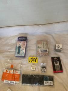 lot 224 image: Variety Set of Skimmies, Tan Towel, Ring Stand, and More