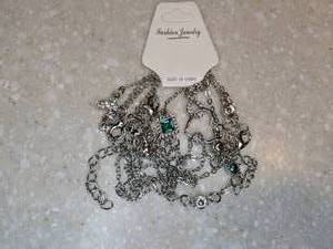 lot 428 image: New Five Piece Stackable Bracelet Set Green Rhinestone Infinity Symbol P