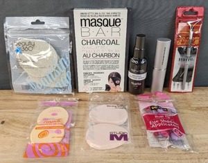lot 105G image: Brand New Beauty 360 Facial Cleansing Sponge, Masque Bar Charcoal Sheet Mask, BYS Makeup Setting Spray, Daily Mirra Brow Brush and Stencil Set, SM Retractable Power Brush, Round Foundation Sponge, Teardrop Blending Sponges and Eyeshadow Applicators N